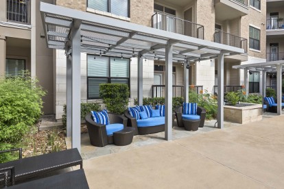 Pool deck cabanas with seating at Camden Lamar Heights 