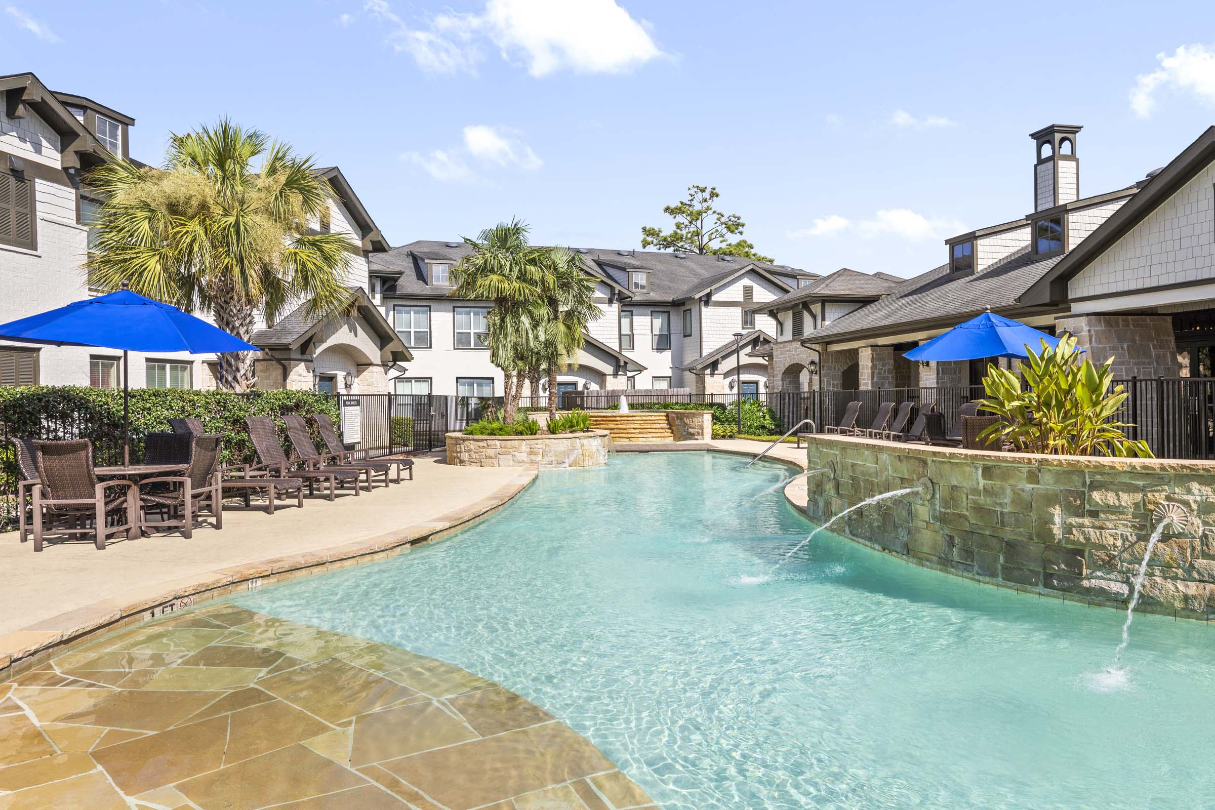 Resort-style pool with fountains at Camden Woodson Park in Houston, TX