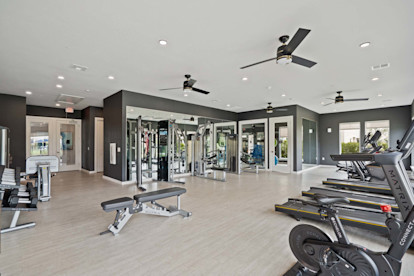 24-hour fitness center with free weights and cardio machines at Camden Leander apartments in Leander, Tx