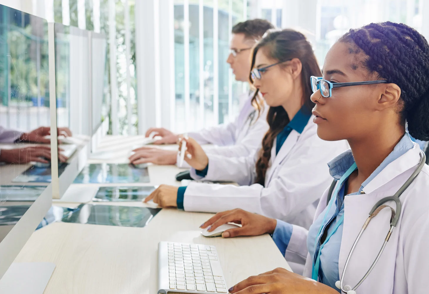 healthcare workers using hospital computers