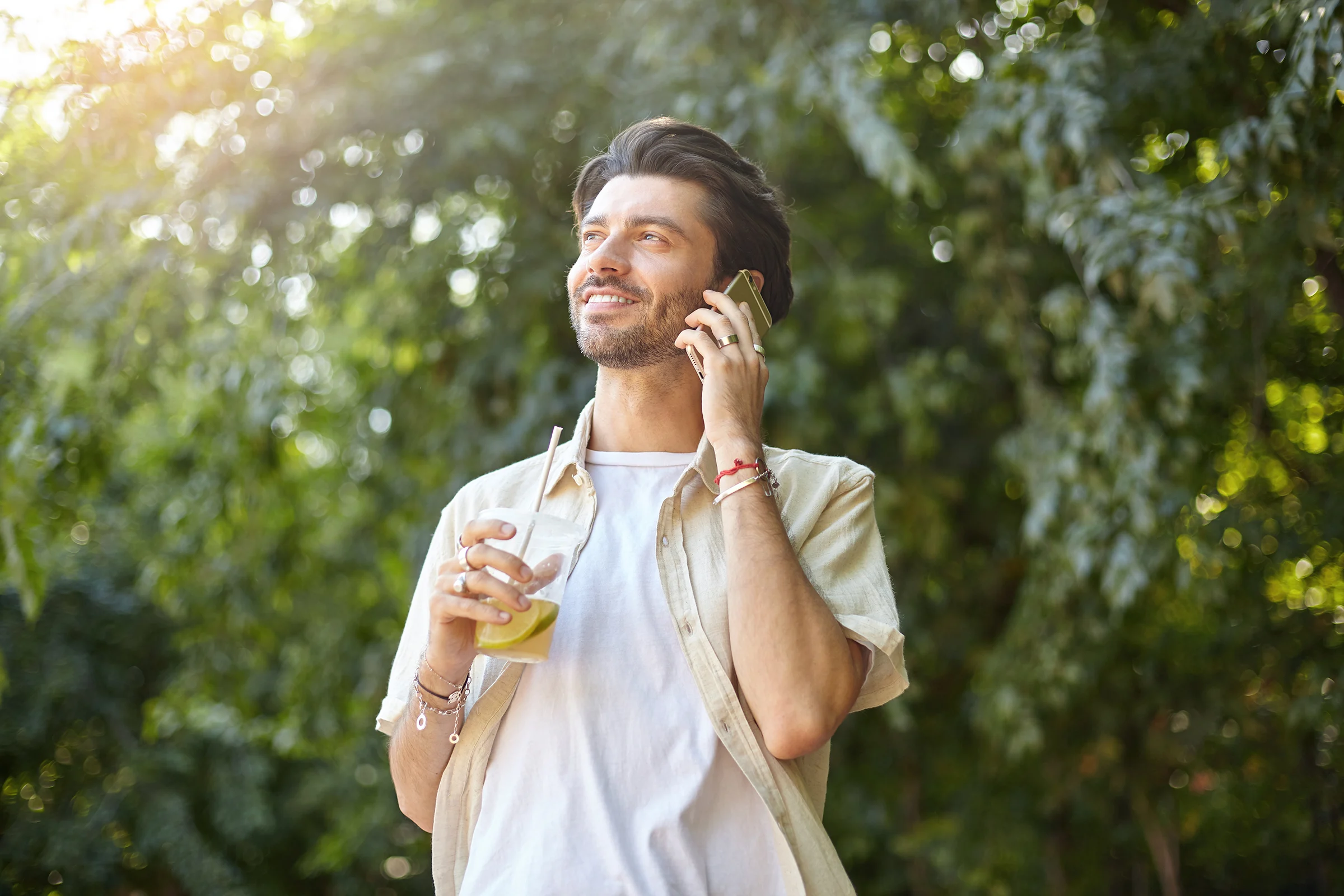 positive young pretty man with beard posing