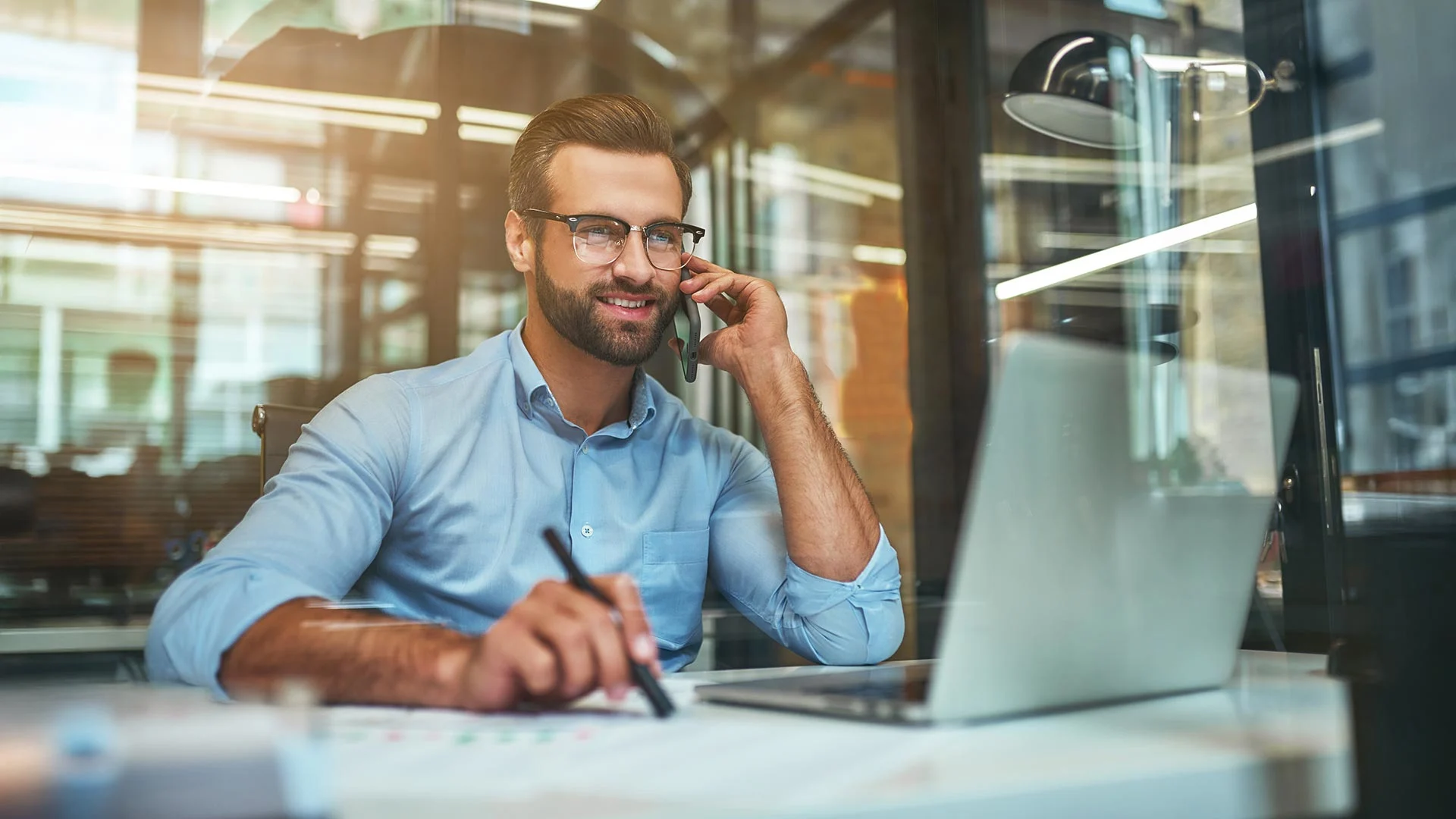 Casual business man on phone in modern office