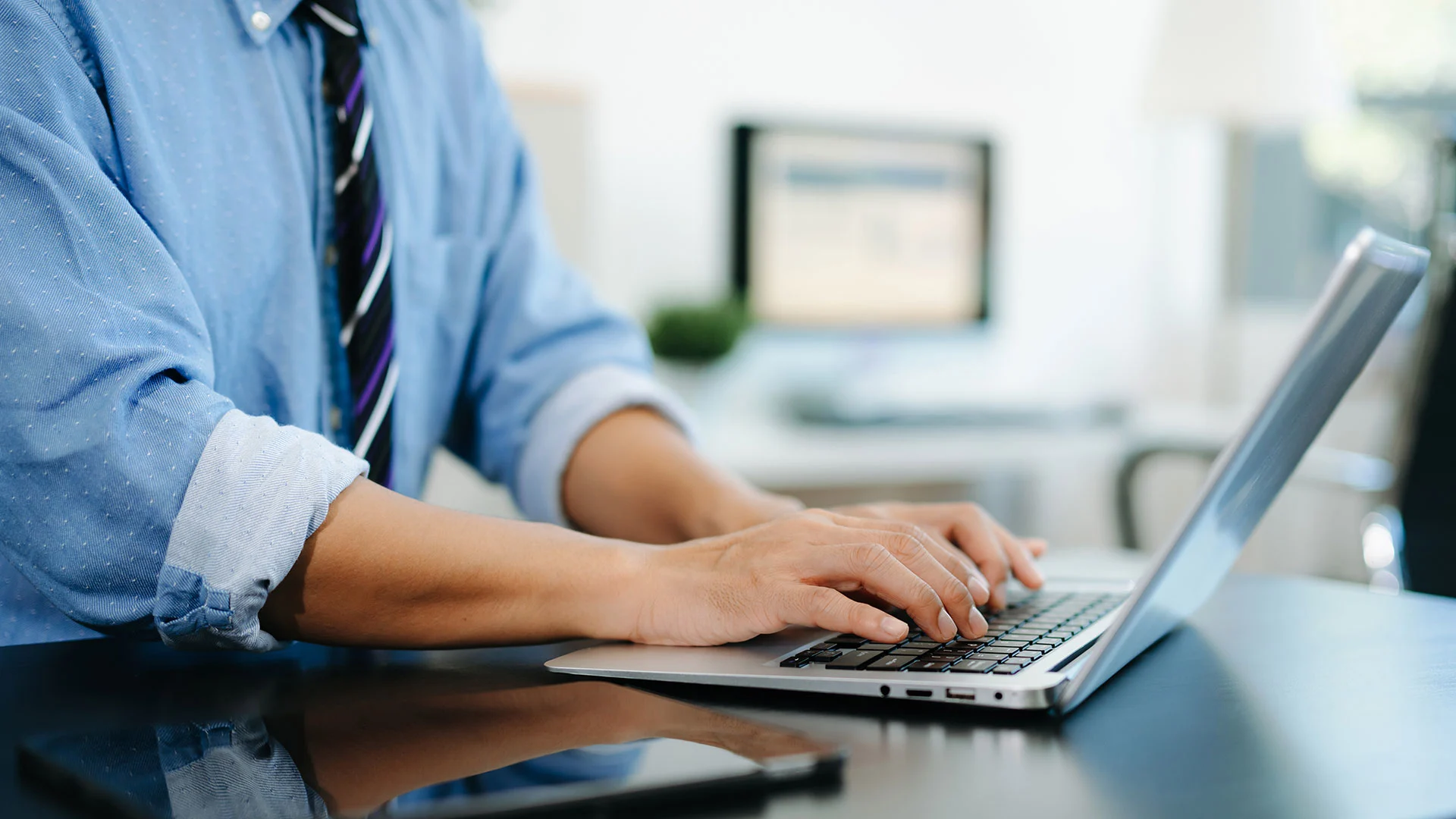 Businessman hands typing on smartphone, tablet and laptop keyboard computer, typing, online