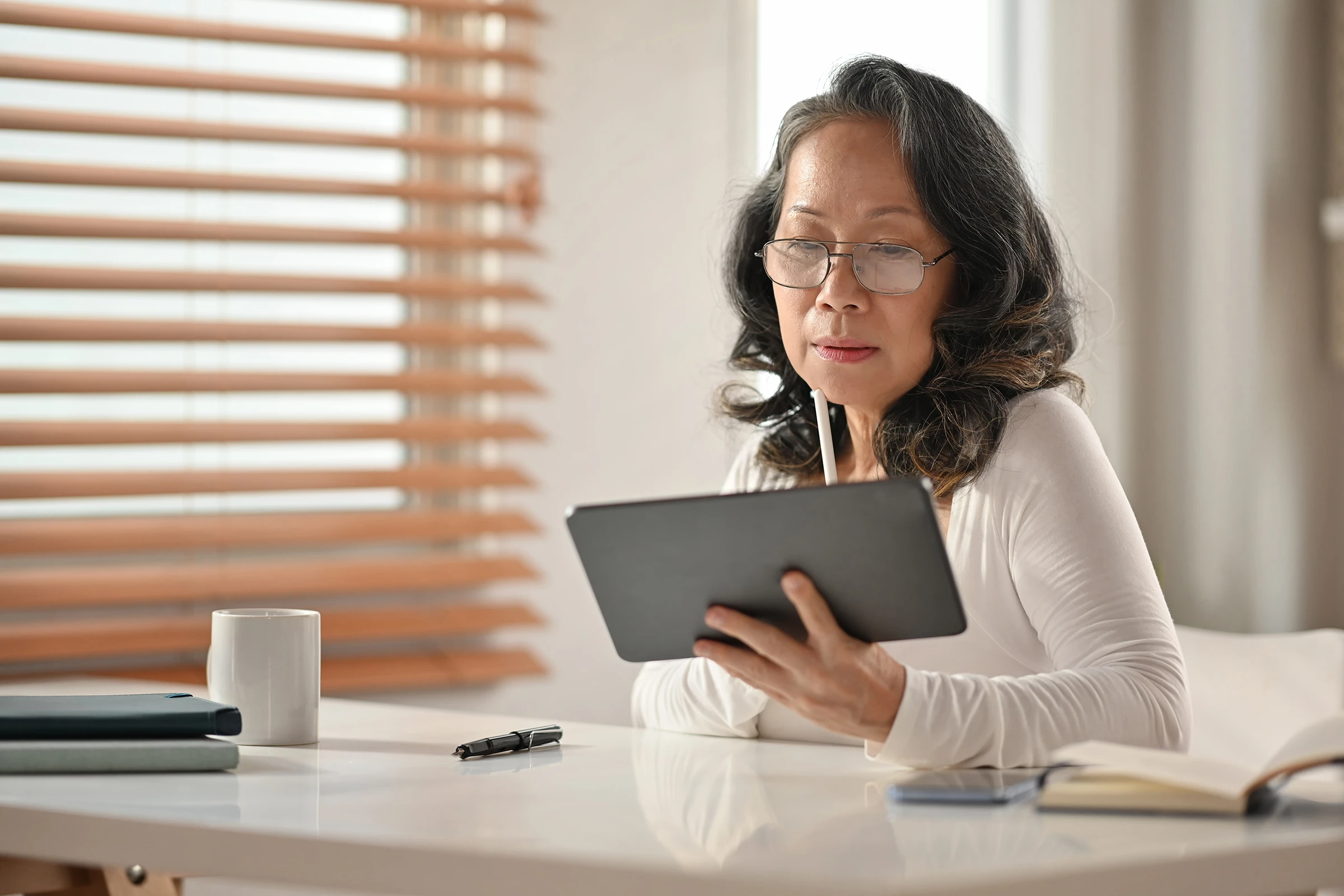 engaged-and-reading-a-report-on-tablet