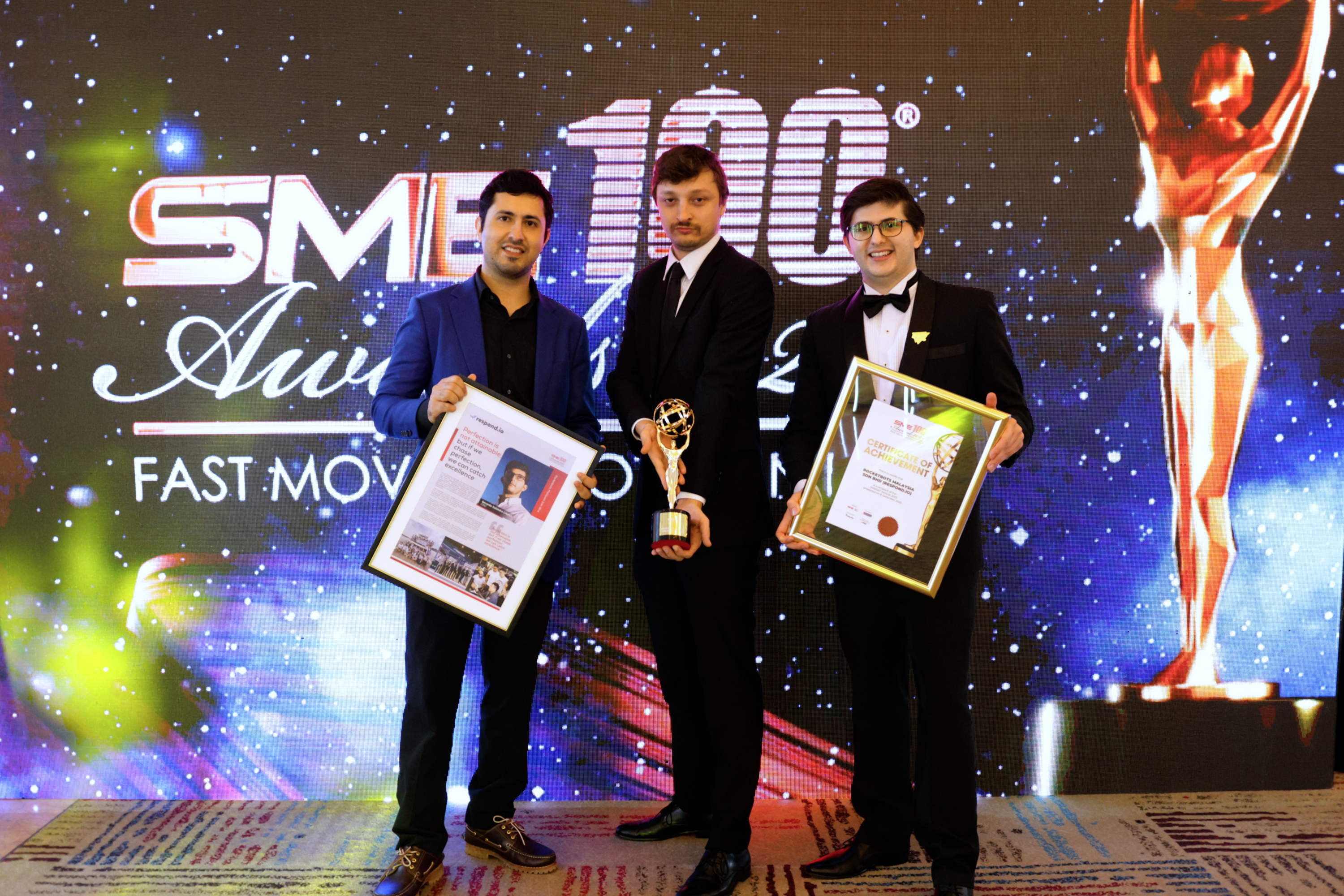 Hassan Ahmed (CTO), Iaroslav Kudritskiy (COO) and Gerardo Salandra (CEO) of respond.io with their SME100 2023 award