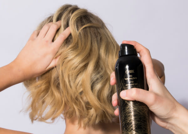 Oribe Dry Texturizing Spray - Product Sprayed onto the Back of Short Blonde Hair - 600 x 428