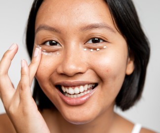best-retinol-eye-creams_woman applying under eye cream_1080x900