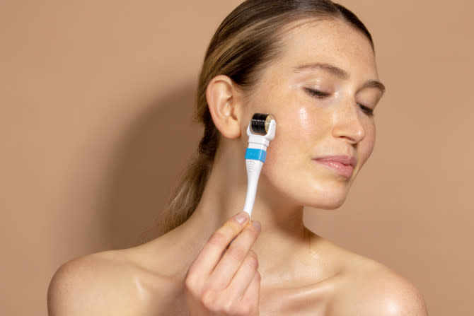 Skinstitut Skininject Derma Roller  - woman using derma roller on side of her face - 670 x 447