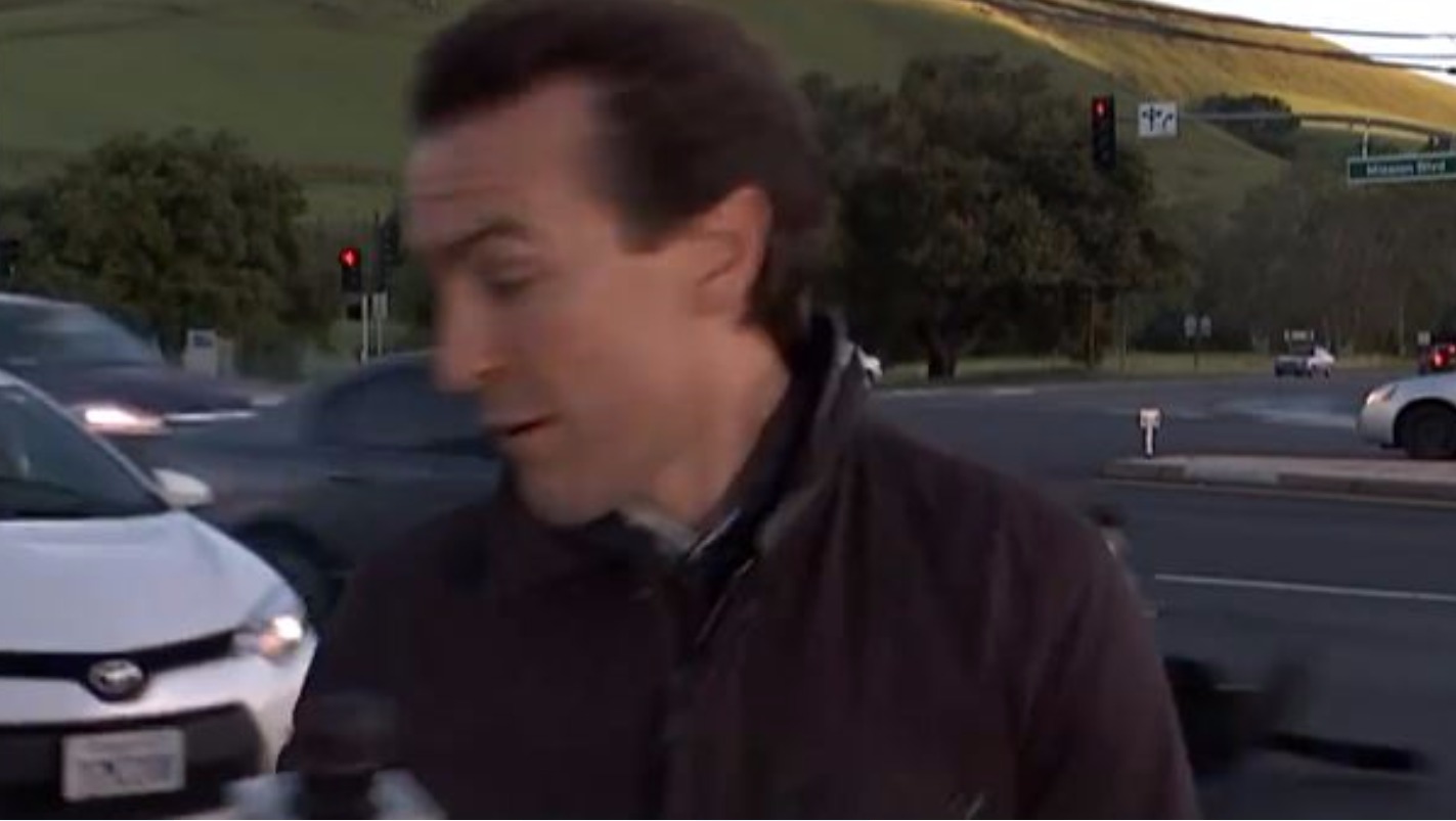TV reporter narrowly escapes getting hit by a car during live report ...