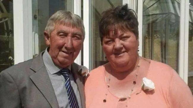 Lyn Brind died after waiting outside hospital in an ambulance for four hours. Her partner, Richard Bunton, has criticised her treatment.