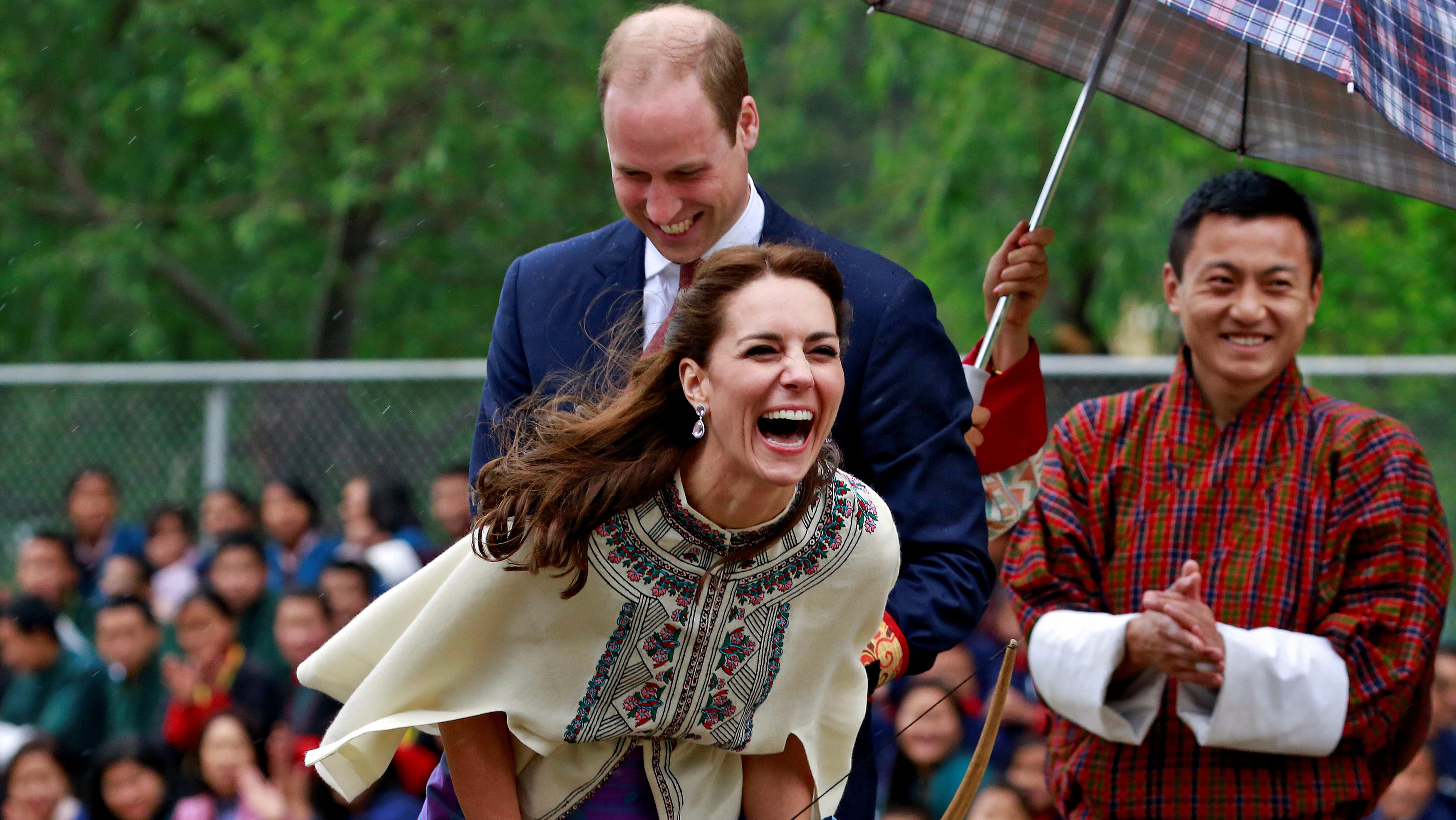 Duchess bursts out laughing at her archery shot on royal visit to ...