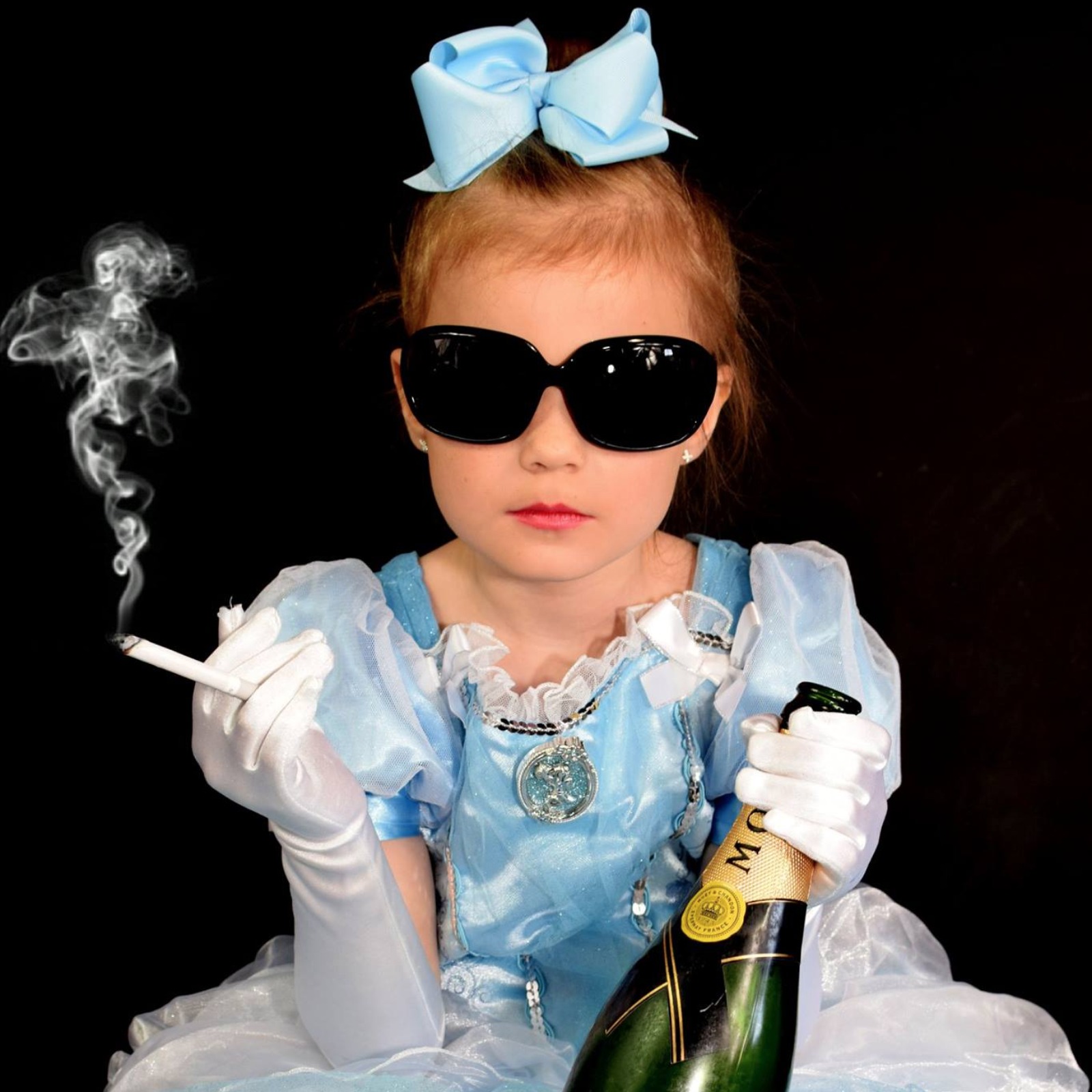 Controversial pictures show little girls 'smoking'