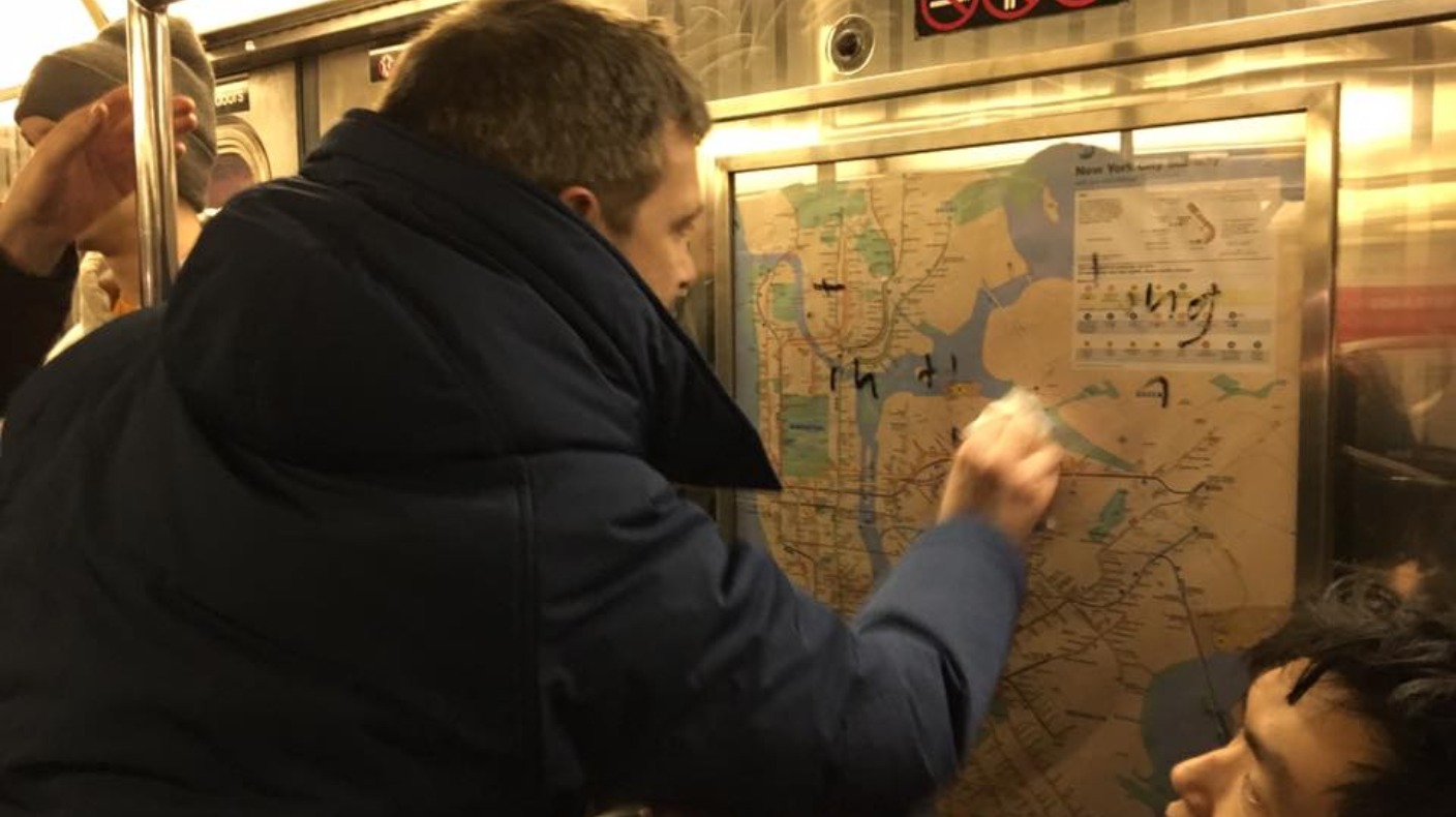 Passengers in New York work together to remove Nazi graffiti from ...