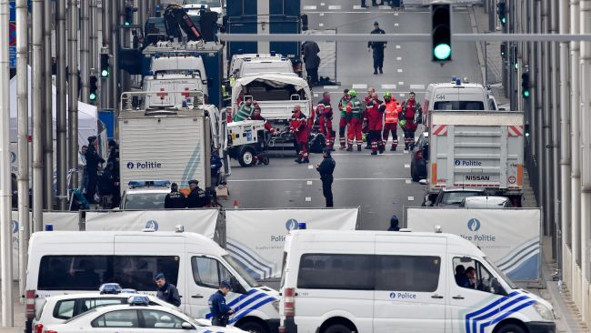 Police and rescue teams are pictured outside a subway station in Brussels, following the terror attack on March 22 2016.