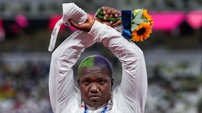 Raven Saunders, of the United States, poses with her silver medal on women's shot put at the 2020 Summer Olympics, Sunday, Aug. 1, 2021, in Tokyo, Japan. During the photo op at her medals ceremony Sunday night, Saunders stepped off the podium, lifted her arms above her head and formed an “X’ with her wrists. Asked what that meant, she explained: ”It’s the intersection of where all people who are oppressed meet.”