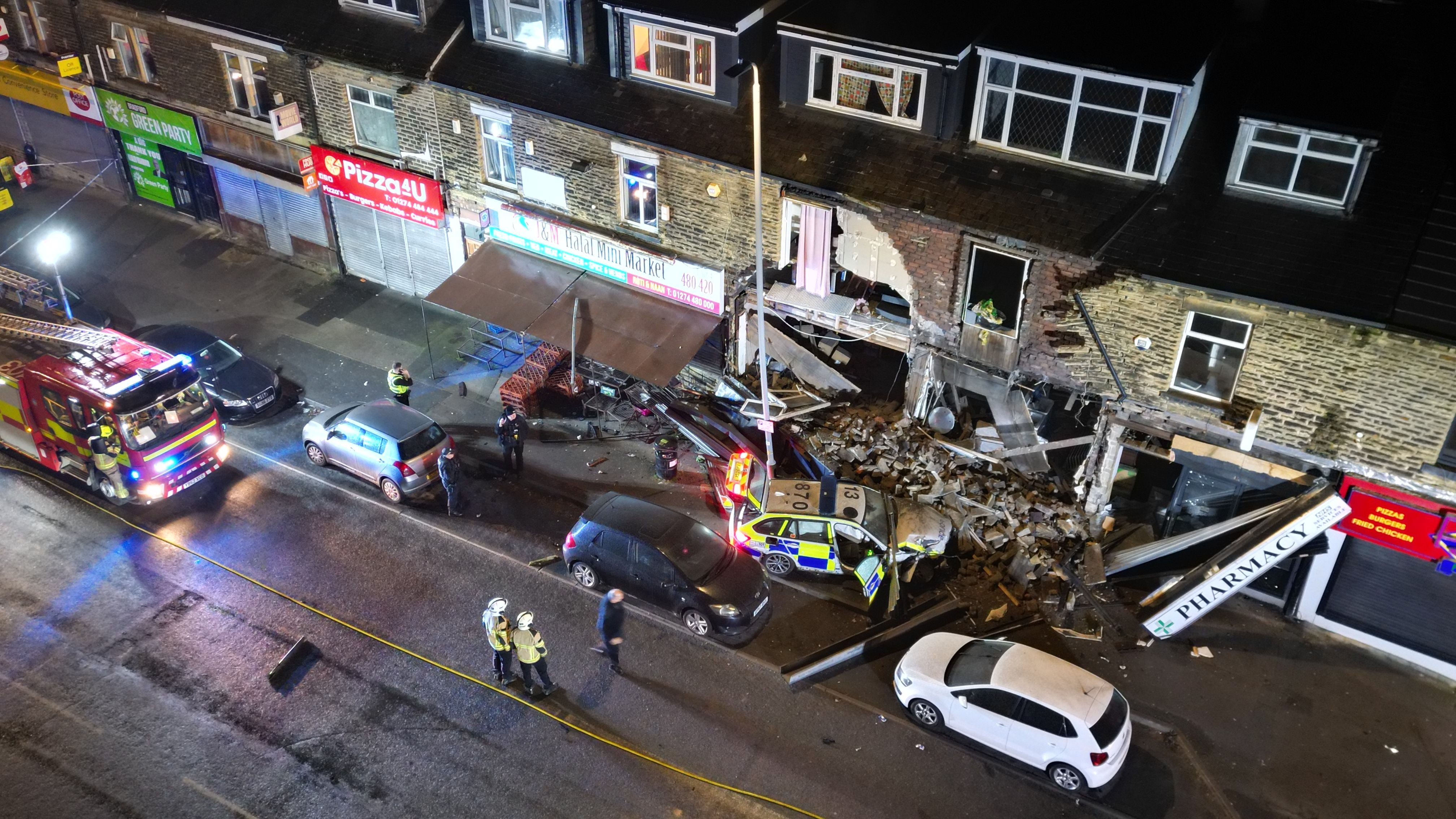 Row of shops damaged in police car crash in Frizinghall Bradford