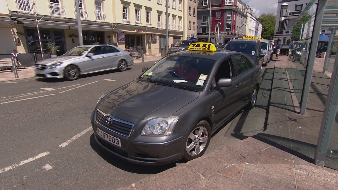 Minister clarifies system taxi drivers are striking over | ITV News Channel