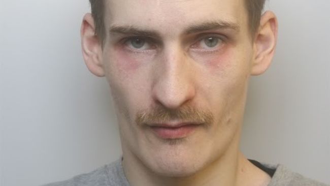 A mugshot of a white man dqxikeidqkikdinv