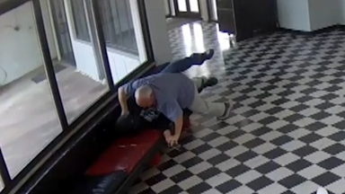 Video shows 'brave' US high school principal tackling armed man in school