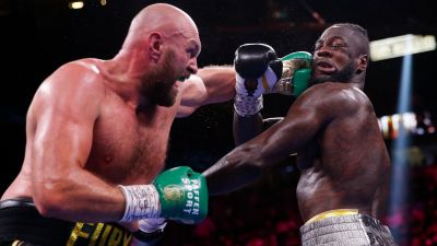 101021 Tyson Fury punches Deontay Wilder during WBA boxing match, AP