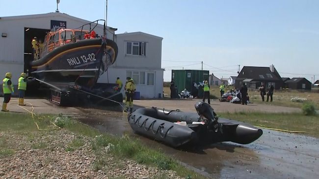 030621-migrants brought into dungeness