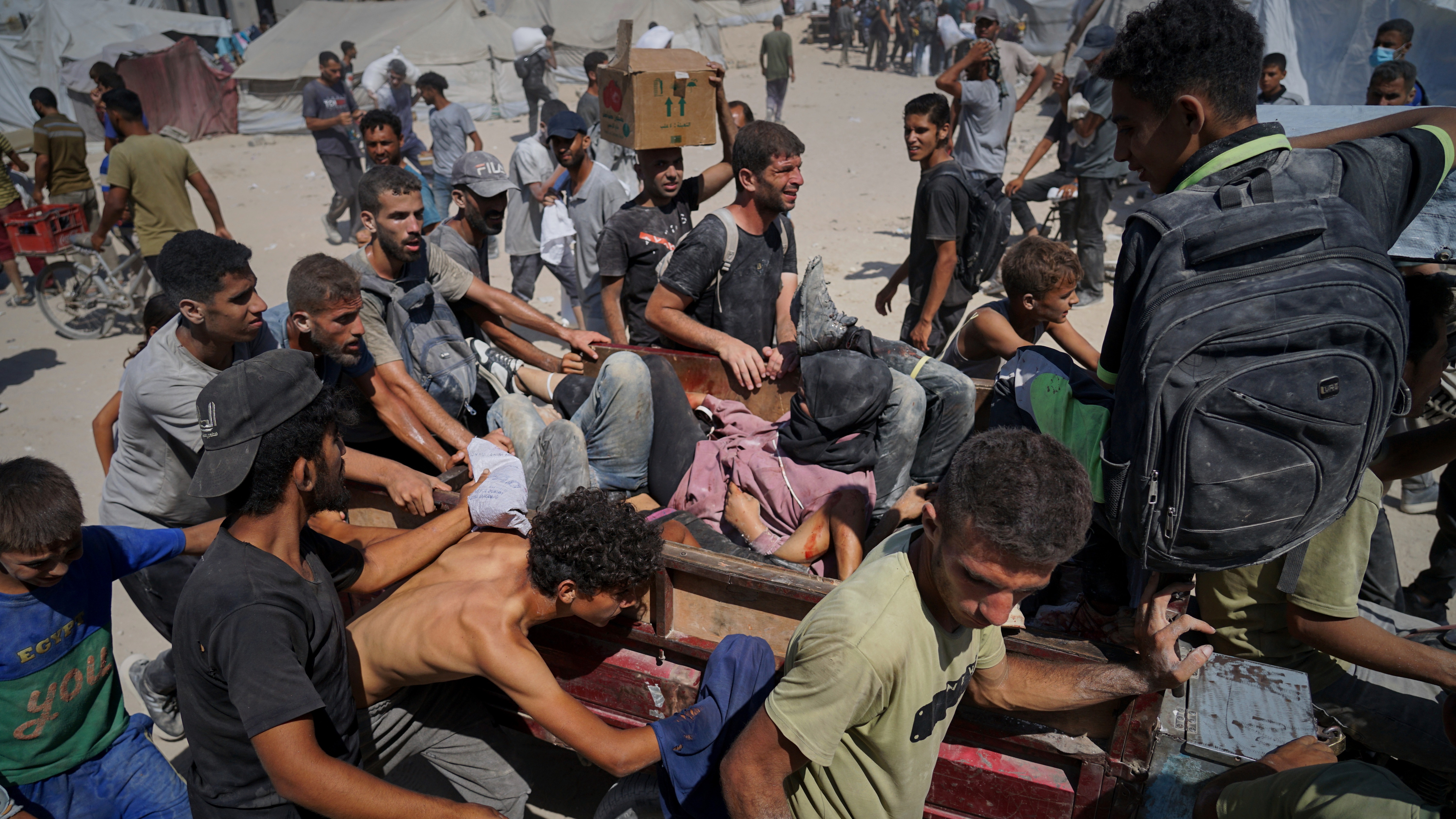 Israeli soldiers again fire on Palestinians seeking aid, killing at least ten