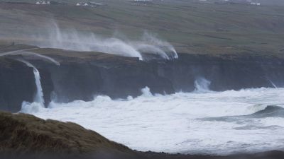 Water is blown back on to the land near Doolin, Co Clare, as Storm Eunice continues to rage across Ireland. More than 55,000 homes, farms and businesses were without power on the island on Friday morning, as the storm tracked eastwards across the Republic. Counties Cork, Kerry and the south of the country have borne the brunt of the major storm so far, which brought high winds and snow to parts of the island. Picture date: Friday February 18, 2022.