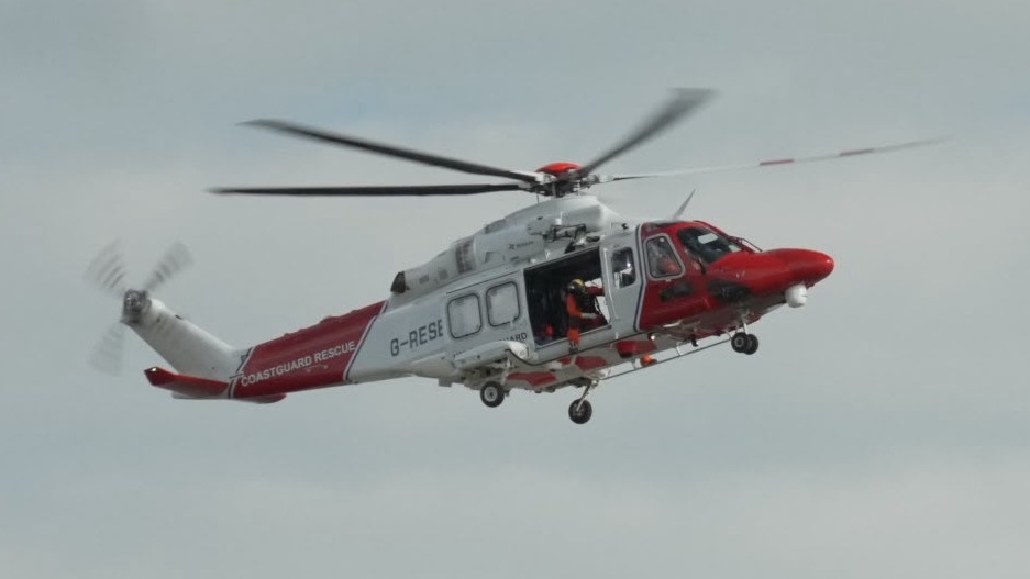 A coastguard helicopter in the sky during the search for a missing boy in Suffolk 