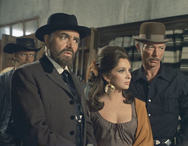 Lollobrigida pictured in Madrid, Spain, while making a film "Bad Man's River" alongside James Mason (left) and Lee Van Cleef.