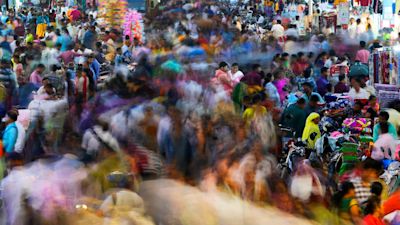 People move through a market in Mumbai, India, Saturday, Nov. 12, 2022. The world's population is projected to hit an estimated 8 billion people on Tuesday, Nov. 15, according to a United Nations projection. (AP Photo/Rajanish Kakade)