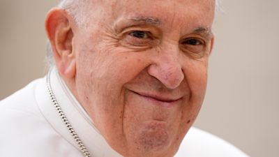 Pope Francis smiles at the end of his weekly general audience in St. Peter's Square at The Vatican, Wednesday, March 8, 2023.