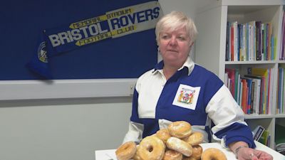 Sarah Shirras in her Norwich school with doughnuts