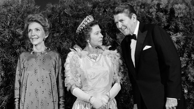President Ronald Reagan and first lady Nancy Reagan pose for photographers with Queen Elizabeth II, in 1983.