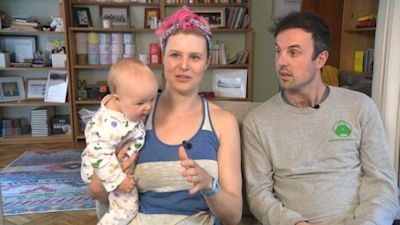 Mcdonald and McNuf with their child Storm.