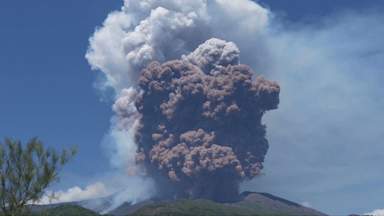 Tourists flee after Mount Etna erupts, sending plumes of ash into the sky