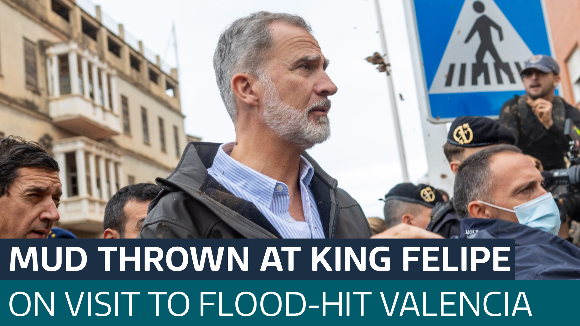 Angry crowds throw mud and shout insults at Spain's King Felipe in