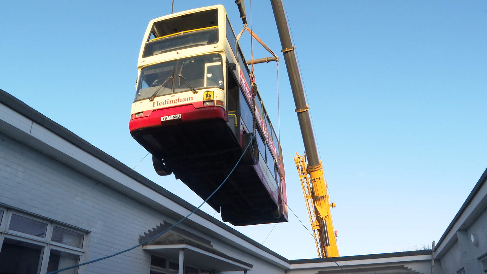 Essex school library bus lifted by crane to safer place after being ...