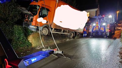 A lorry got stuck on top of a wall in Sandford, near Crediton.