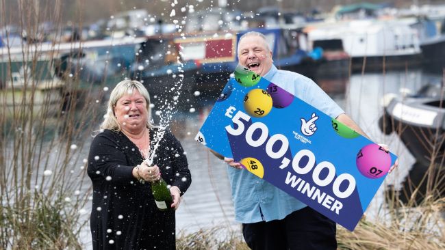 Jeff Etherington with his partner Kim Read after he won £500,000.
Credit: PA