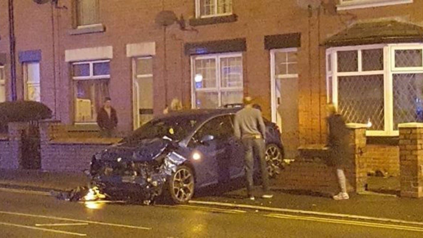 Pictures show dramatic aftermath following smash in which a car nearly  landed on top of another - Manchester Evening News