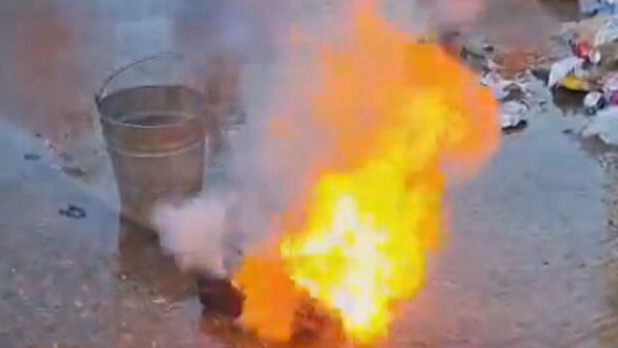 Moment battery reacts violently catching fire and giving off toxic