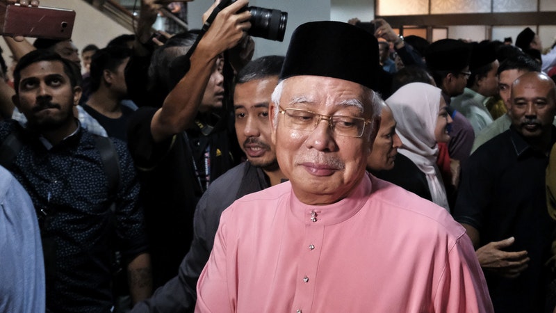 Former Malaysian leader and his wife are barred from leaving country ...