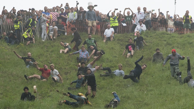 Cheese Rolling Race champion savours victory in downhill dash but won't eating his prize | ITV