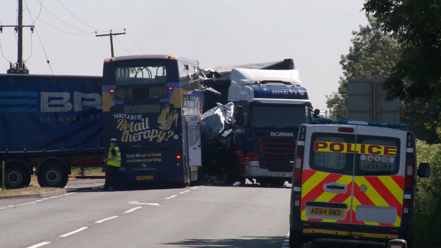 Two dead and five seriously injured in crash between lorry and bus