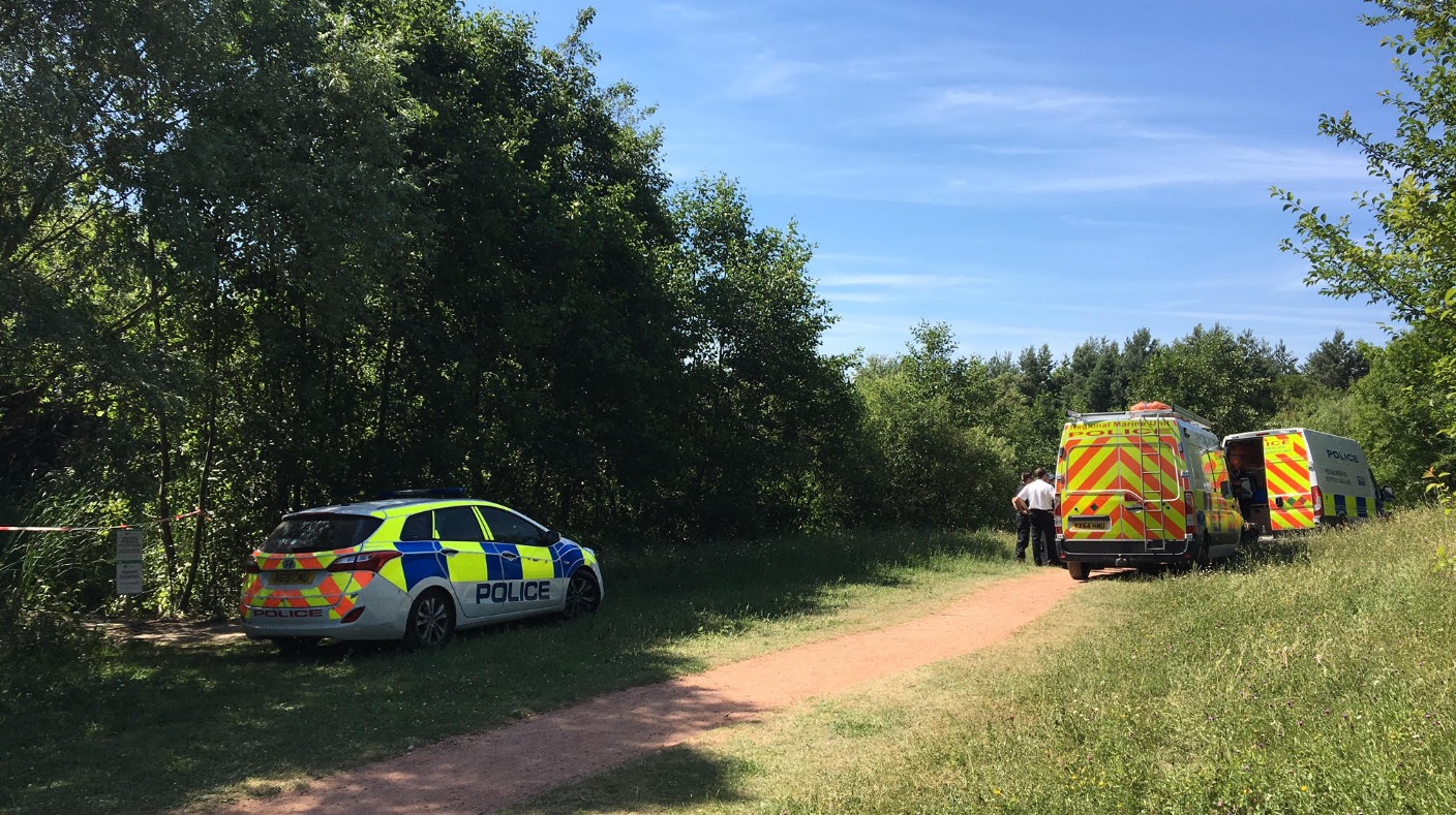 Police divers search for a man missing after swimming in a lake | ITV ...