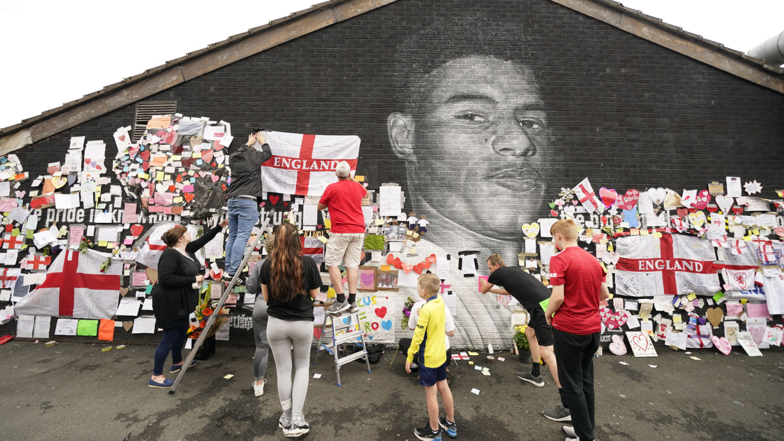 Close up of a small part of the giant Manchester United player Marcus  Rashford mural in Withington, Manchester, England, United Kingdom, that was  vandalised with abusive graffiti after England's Euro2020 football loss