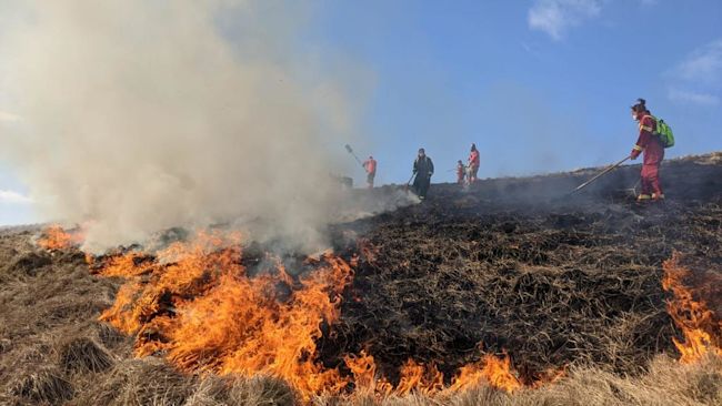 Derbyshire crews were first called to Rushup Edge at 13:34 BST on Saturday when fire spread across seven acres of farmland