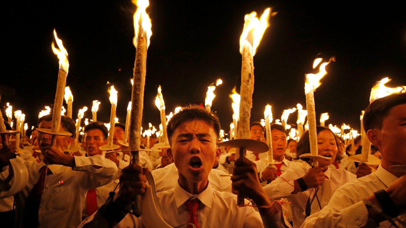 North Korea lights up as tens of thousands take part in torch parade
