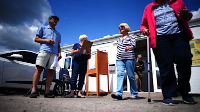 People leave a polling station at Frome Cricket Club during a by-election vote in 2023.