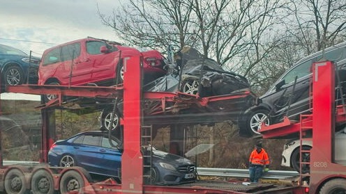 Motorway closed after car transporter hits railway bridge over M621